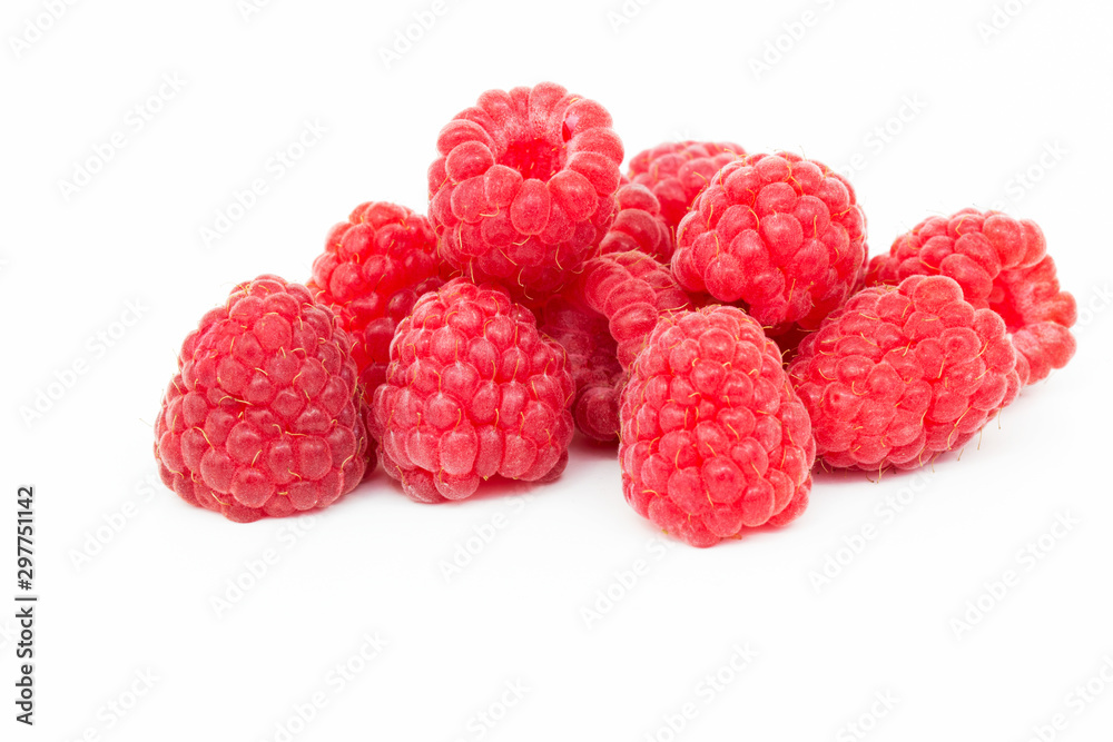 Fresh ripe red raspberries on a white table Fresh ripe red raspberries on a white table