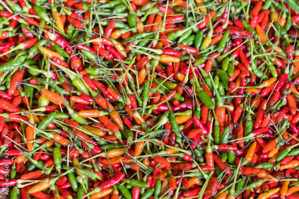 Red hot chilli peppers pattern texture background. Close up. A backdrop ofRed hot chilli peppers. Food product Color red green chilli pepper