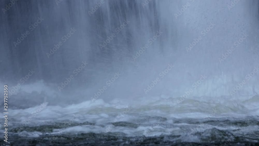 Focus falls on the river below with white bubble waves. Focus falls on the river below with white bubble waves.
