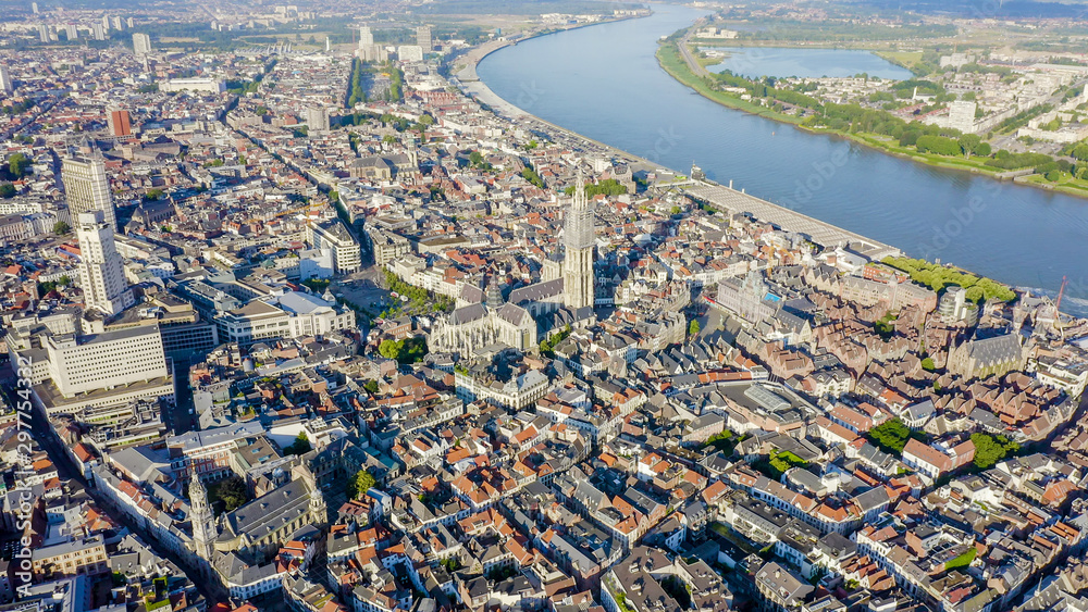 Antwerp, Belgium. Flying over the roofs of the historic city. Schelde (Esco) river. Cathedral of
