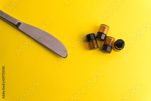 Composition of bottles for aroma, essential oil or medicine on a yellow background in other perspective. Soft focus in the middle..