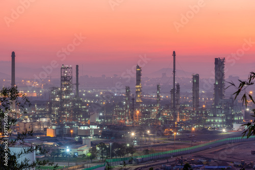 Landscape of Oil and Gas Refinery Manufacturing Plant.  Petrochemical or Chemical Distillation Process Buildings.  Factory of Power and Energy Industrial at Twilight Sunset.  Engineering Petroleum.