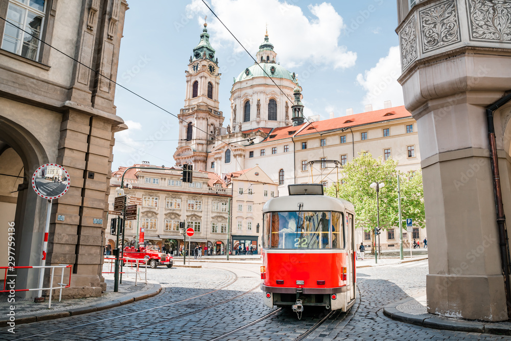 Red tram on the street of old Prague - obrazy, fototapety, plakaty 