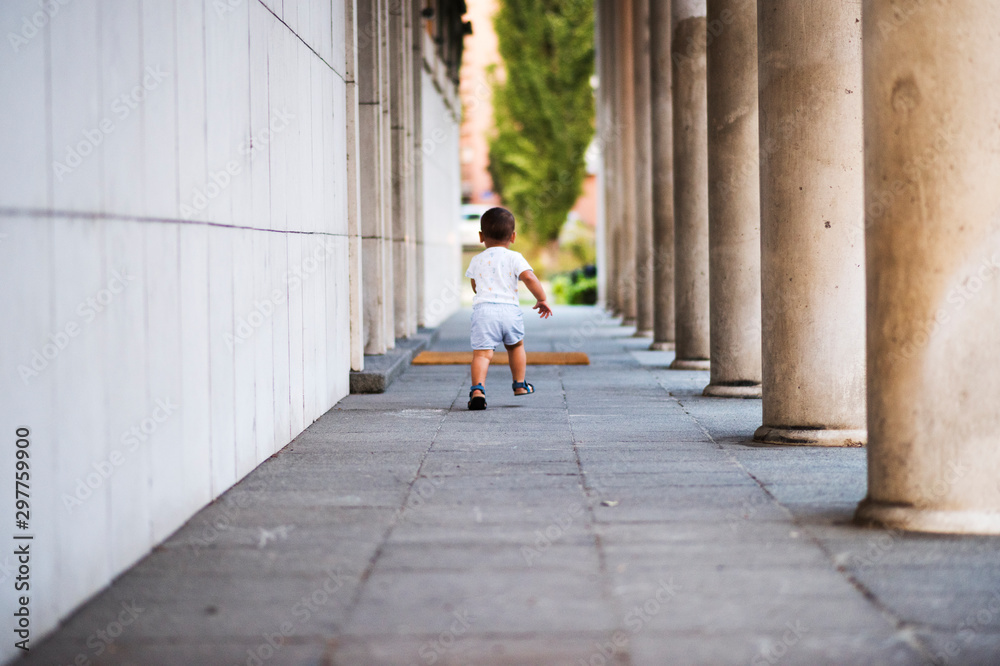 Boy walking on the street Boy walking on the street
