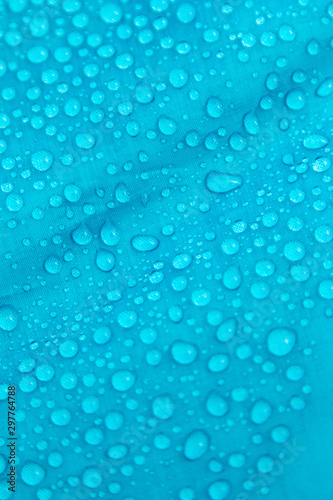 clear water drops on blue background