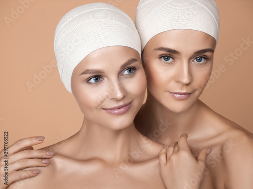 Portrait of beautiful young women isolated on brown studio background. Caucasian female models looking at camera and posing. Concept of women's health and beauty, self-care, body, skin care, treatment