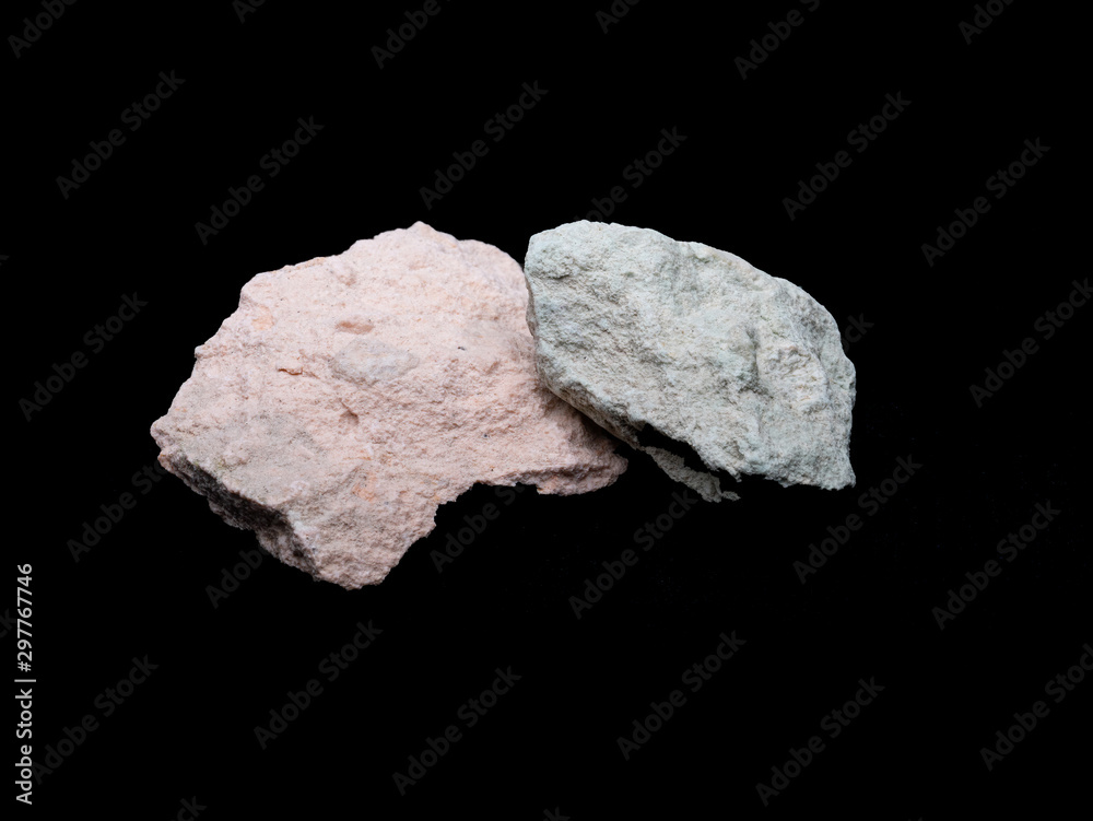 Zeolite natural raw stones on black background. Macro shot