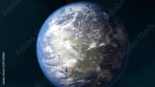 Earth and sun. The camera flies around the planet. The earth is approaching. A view from space.  Realistic atmosphere. Starry sky. All continents are visible. White clouds envelop the planet.