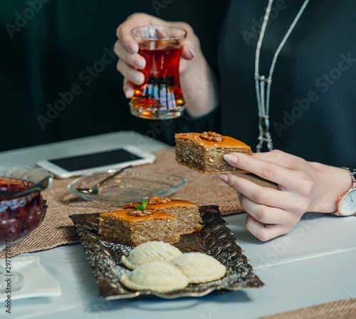 pakhlava and shekerbura presented in vintage platter in tea setup photo