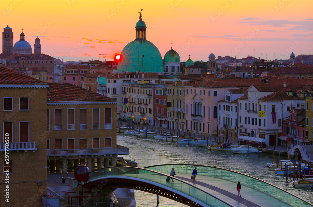 Fototapeta Venice at sunrise. View from the upper deck of a parking garage.