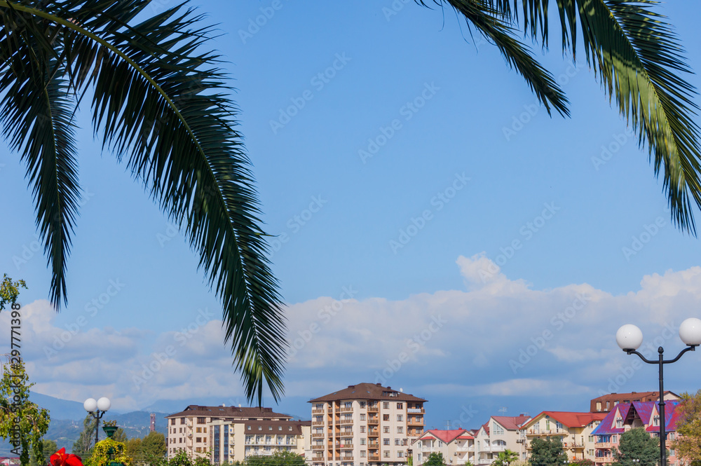 View to the Sochi. Sea coast wth houses and mountains under blue sky
