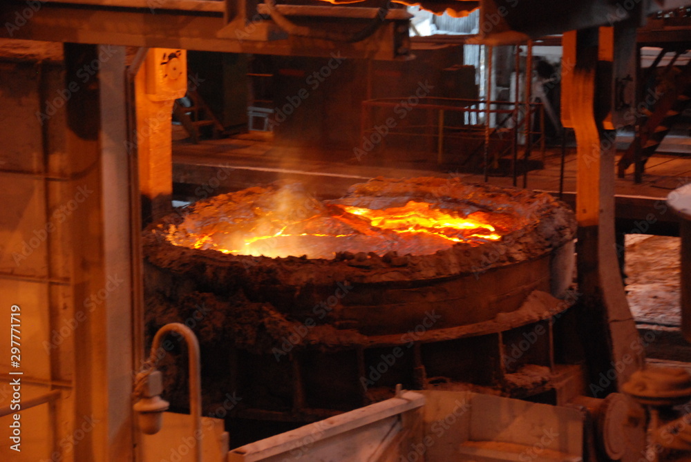 Very rare close view of working open hearth furnace at the metallurgical plant. Molten hot steel