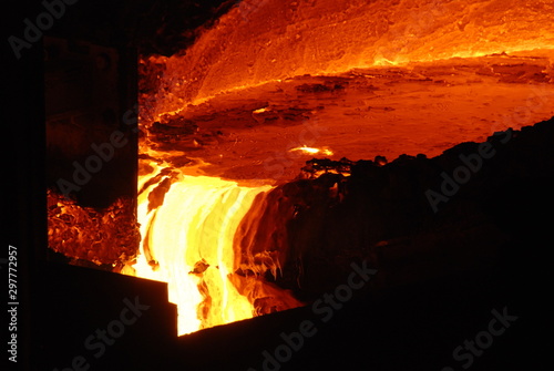 Very rare close view of working open hearth furnace at the metallurgical plant. Molten hot steel