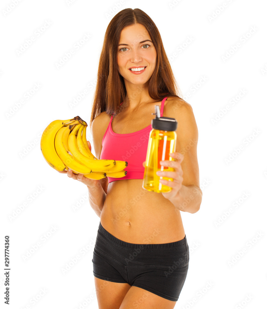 Beautiful young model with bananas, isolated on white background