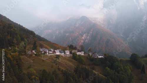 Autumn aerial view of Strmec na Predelu village, at the feet of the Julian Alps, in Triglav national park, Slovenia photo