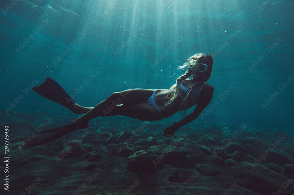 girl dives underwater
