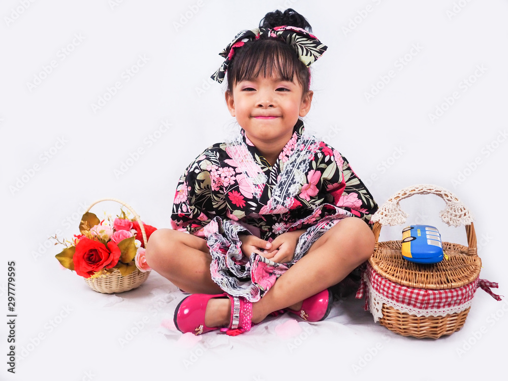 asian little girl Wearing yukata with fruit basket on white backgound asian little girl Wearing yukata with fruit basket on white backgound