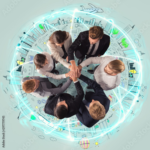 Handshaking business person above a round and ccreative drawing. concept of teamwork and partnership. photo