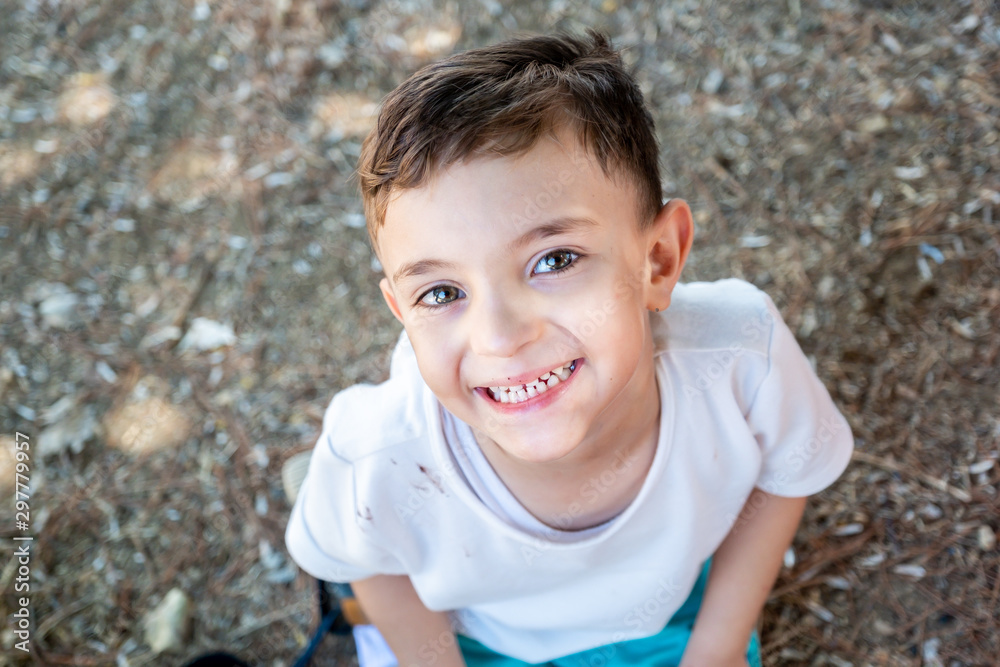 Happy muslim arabic boy playing in hte park