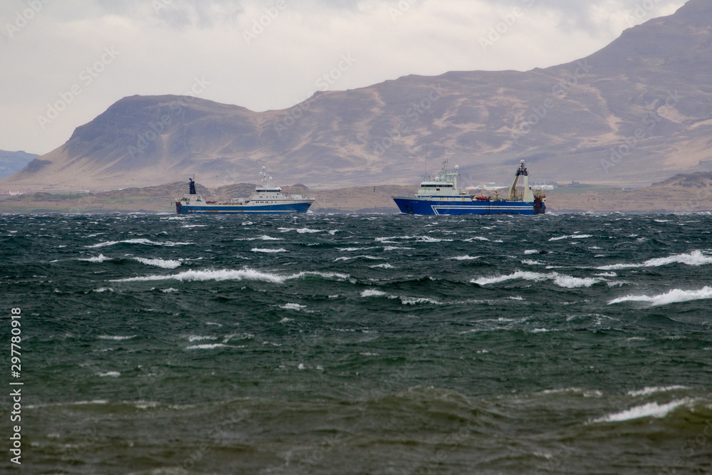 Two Icelandic fishing trawlers pass by each other. Trawler is a ...