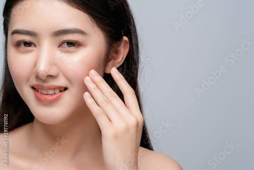 beauty asian attractive female bare healthy facial skin hand touch serum of cheek portrait half body make up skin concept