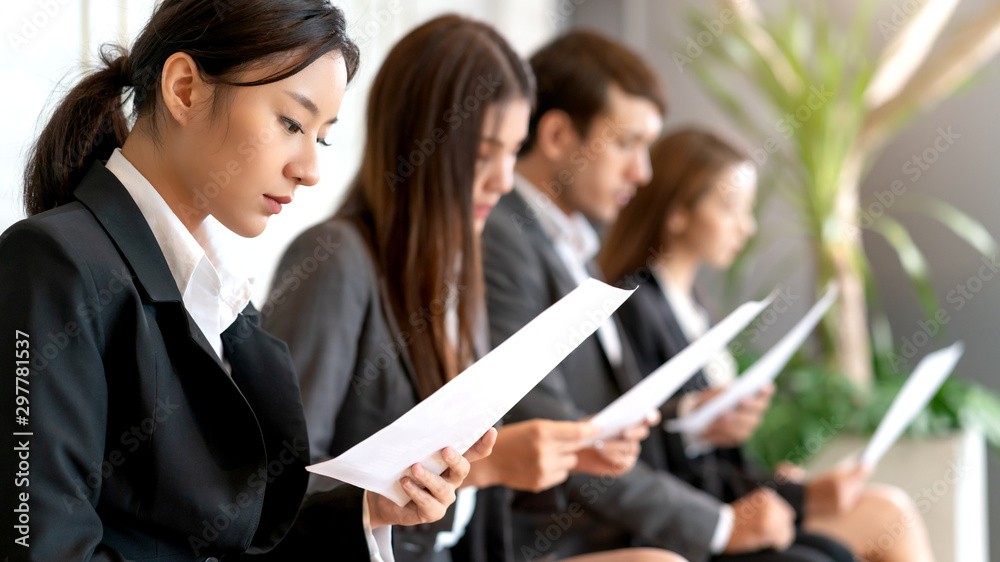 group of candidate asian business People sitting in a row, waiting in line for job interview group of candidate asian business People sitting in a row, waiting in line for job interview