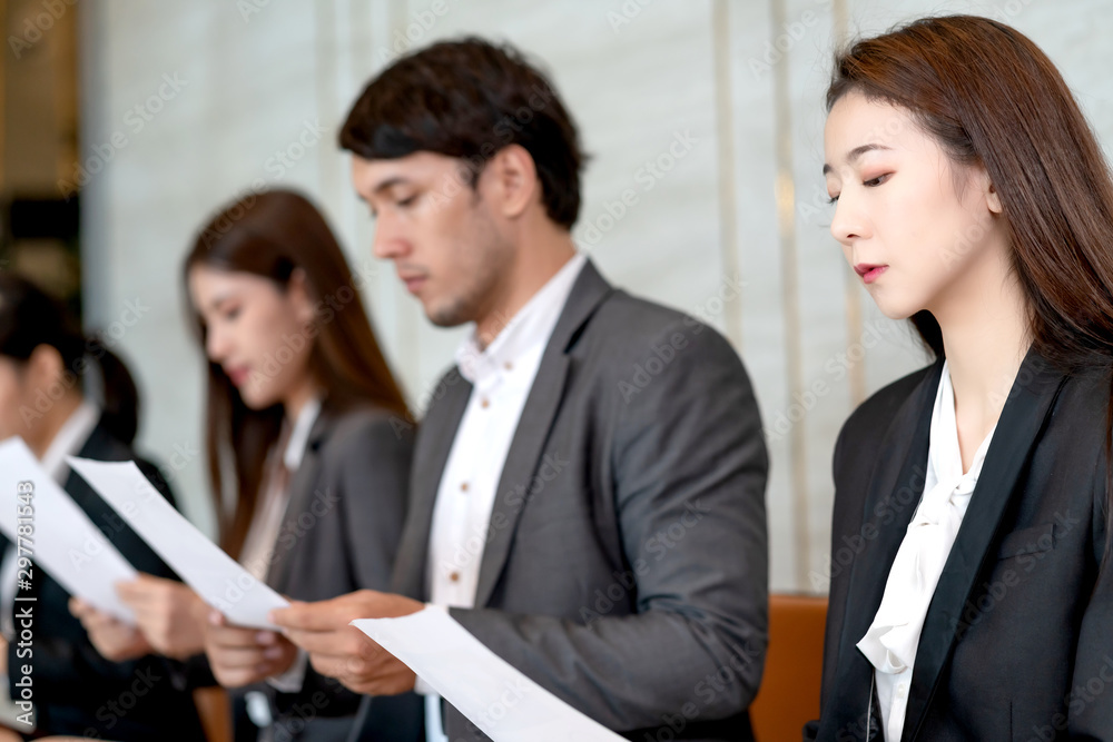 group of candidate asian business People sitting in a row, waiting in line for job interview group of candidate asian business People sitting in a row, waiting in line for job interview