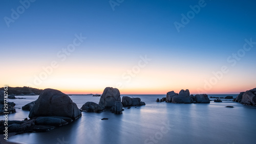 Sunrise over boulders at Cavallo Island in Corsica