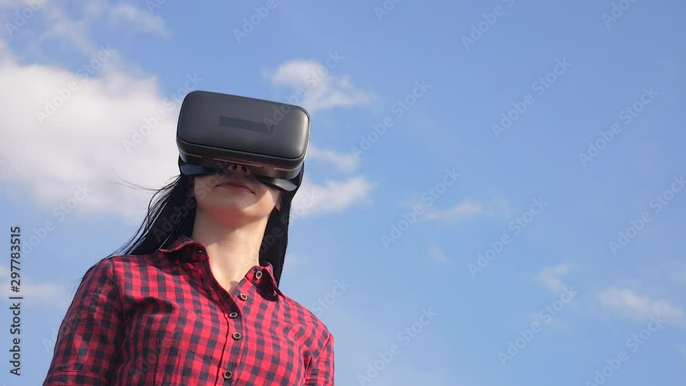 woman Augmented teamwork future reality device creating virtual space concept lifestyle slow motion video. girl in virtual digital glasses the virtual reality. woman using a VR-headset woman Augmented teamwork future reality device creating virtual space concept lifestyle slow motion video. girl in virtual digital glasses the virtual reality. woman using a VR-headset