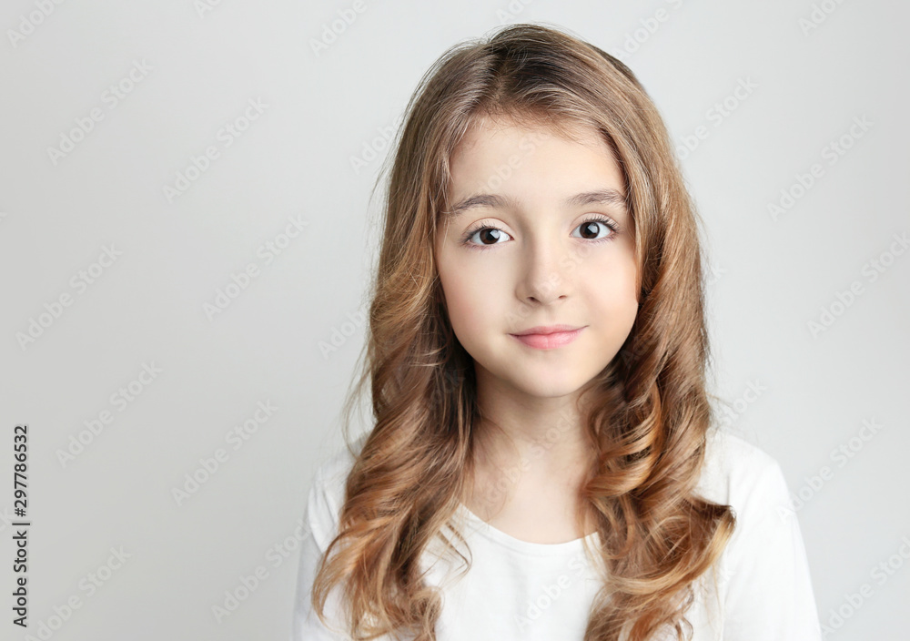 Caucasian child girl portrait on grey background empty copy space. Caucasian child girl portrait on grey background empty copy space.