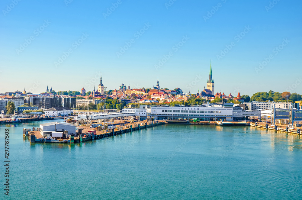 Beautiful cityscape of Tallinn, Estonia photographed from the cruise with harbor by the Gulf of Finland. Estonian capital, Baltic states. Sign Tallinn on the terminal building