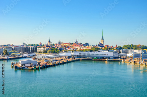 Beautiful cityscape of Tallinn, Estonia photographed from the cruise with harbor by the Gulf of Finland. Estonian capital, Baltic states. Sign Tallinn on the terminal building