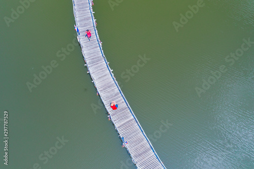 Aerial view of wood bridge cross the river and blusky with cloud in Chumphon province. photo