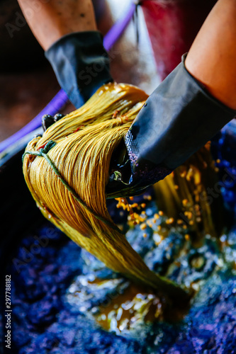 Thai traditional fabric process. Process of dye fabric indigo color. Indigo dye cotton thread in Thailand