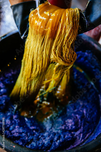 Thai traditional fabric process. Process of dye fabric indigo color. Indigo dye cotton thread in Thailand