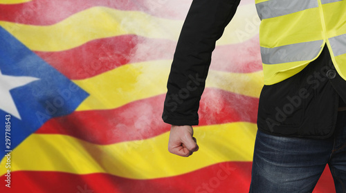Yellow vests protests in Catalonia. Unrecognizable man clenched his fist in protest separatism concept. photo