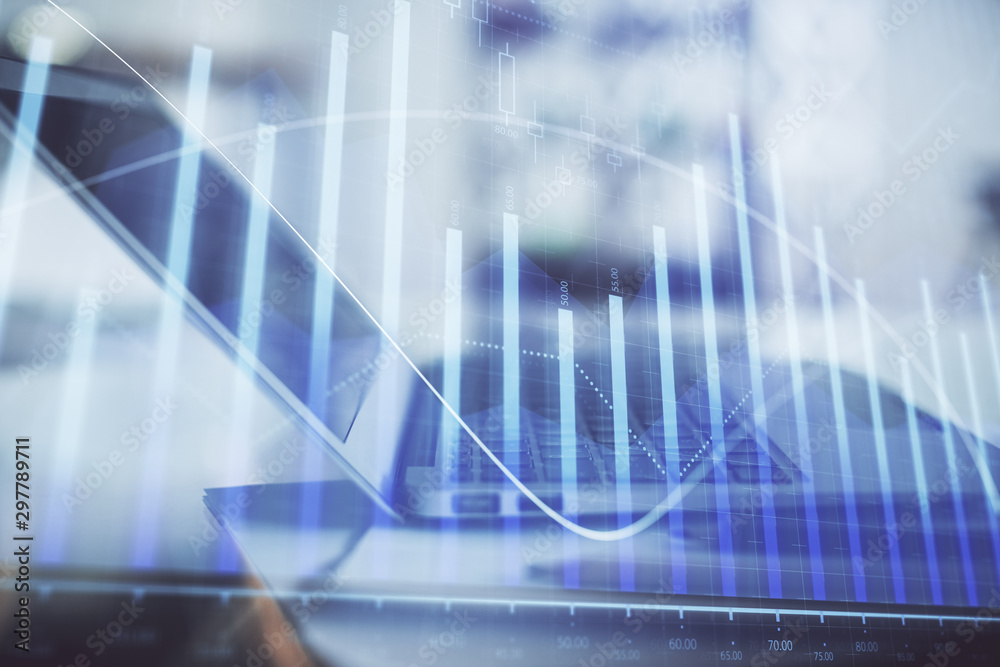 Forex graph hologram on table with computer background. Double exposure. Concept of financial markets. Forex graph hologram on table with computer background. Double exposure. Concept of financial markets.