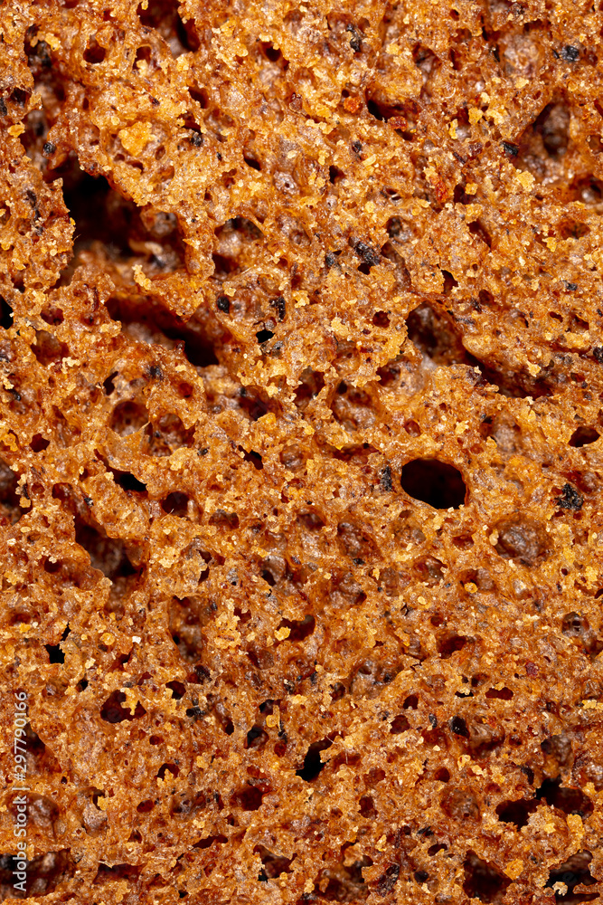 Black rye bread as an abstract background