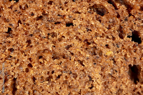 Black rye bread as an abstract background