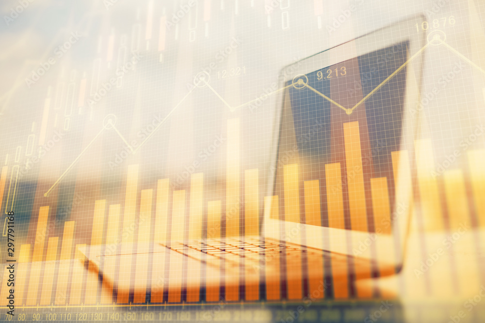 Stock market chart hologram drawn on personal computer background. Double exposure. Concept of investment. Stock market chart hologram drawn on personal computer background. Double exposure. Concept of investment.