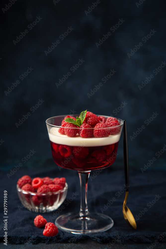 Vanilla panna cotta and raspberry jelly dessert foto de Stock Adobe Stock