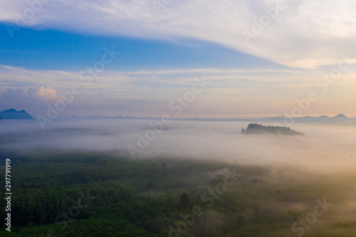 Aerial view of mountains with cloud cover mountain at sunrise and blue sky in Surat Thani Province  Thailand.