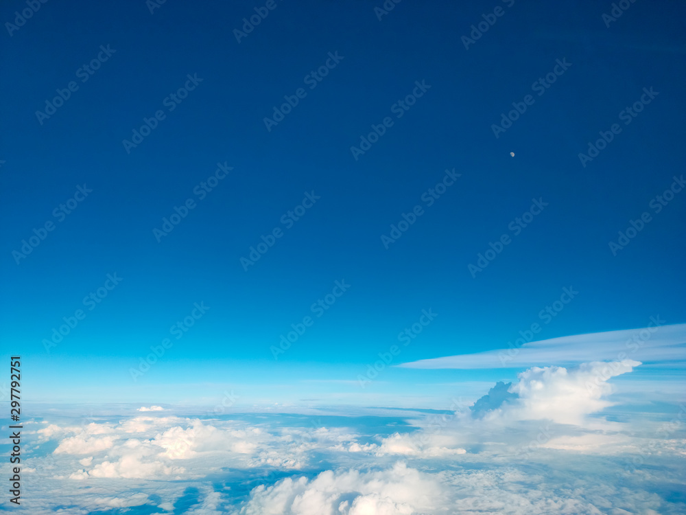 Sunrise above clouds from airplane window. Bright blue sky top horizontal view copyspace. Travelling concept View of the engine. Sunrise above clouds from airplane window. Bright blue sky top horizontal view copyspace. Travelling concept View of the engine.