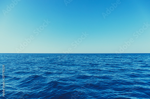Blue sea surface with waves and horizon © hdesert