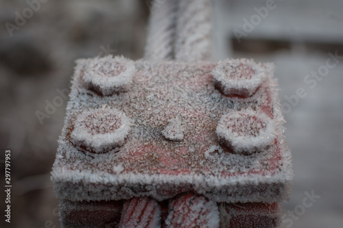 Metal rope and plae covered in frost. photo