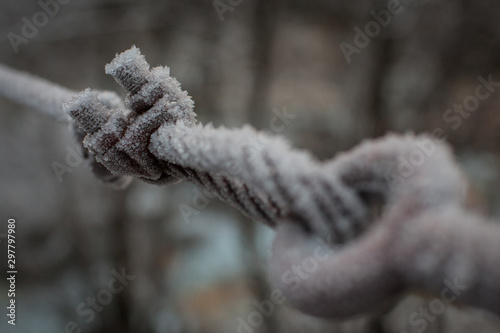 Metal rope covered in frost.