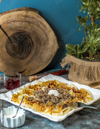 azerbaijani khangal thinly cutted dough topped with minced meat and caramelized onion 1 photo