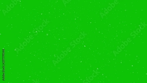 Winter snow falling on a green screen background photo