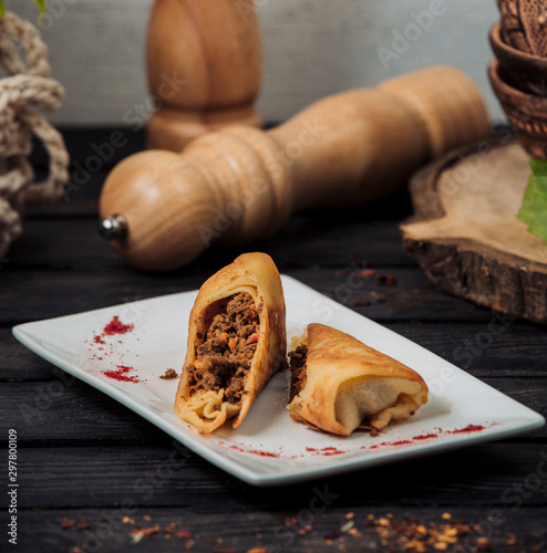 crepe wrap with minced meat and tomato mix photo