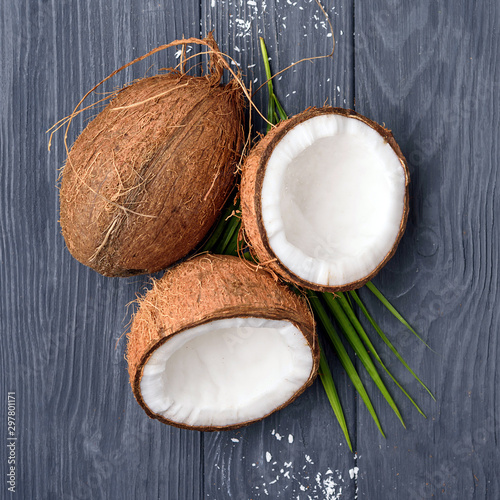 three brown coconut on old wooden board